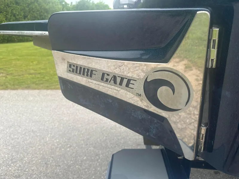 Slide: The Image of 2022 Malibu M220 Surf Gate feature on a boat, enhancing wake surfing experience. - 17