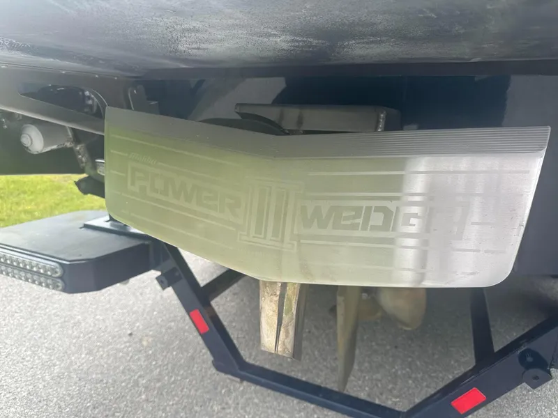 Slide: The Image of 2022 Malibu M220 Power Wedge III detail on boat trailer. - 31