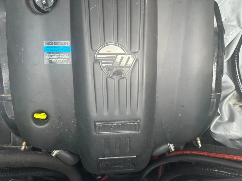 Slide: The Image of 2022 Malibu M220 engine cover with Monsoon branding and ISO certification label. - 5