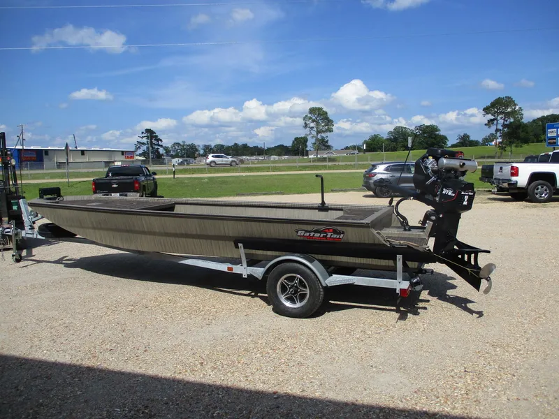 Slide: The Image of 2025 Gator Tail 2048 EXTREME boat on trailer, parked outdoors under a clear blue sky. - 1