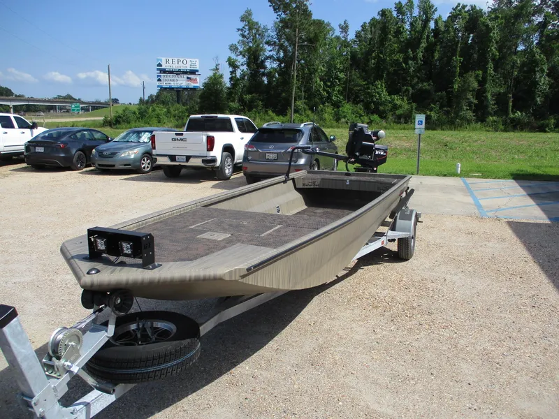 Slide: The Image of 2025 Gator Tail 2048 EXTREME boat on trailer in parking lot. - 2