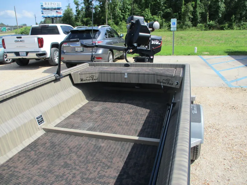 Slide: The Image of 2025 Gator Tail 2048 EXTREME boat in parking lot, featuring spacious interior and modern design. - 7