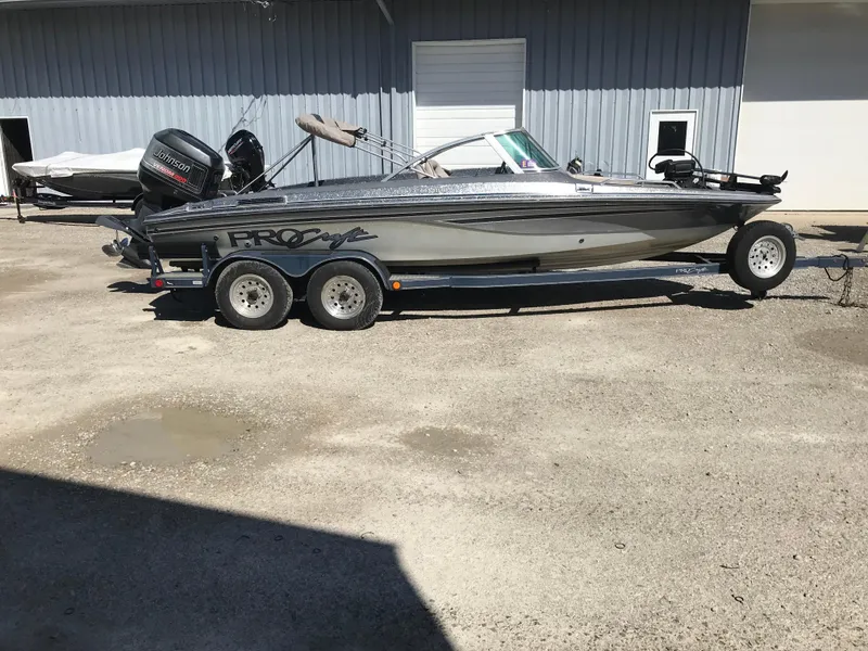 Slide: The Image of 1994 ProCraft COMBO 200 boat on trailer, parked outdoors. - 0