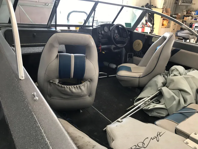 Slide: The Image of Interior of a 1994 ProCraft COMBO 200 boat with seating and dashboard. - 12