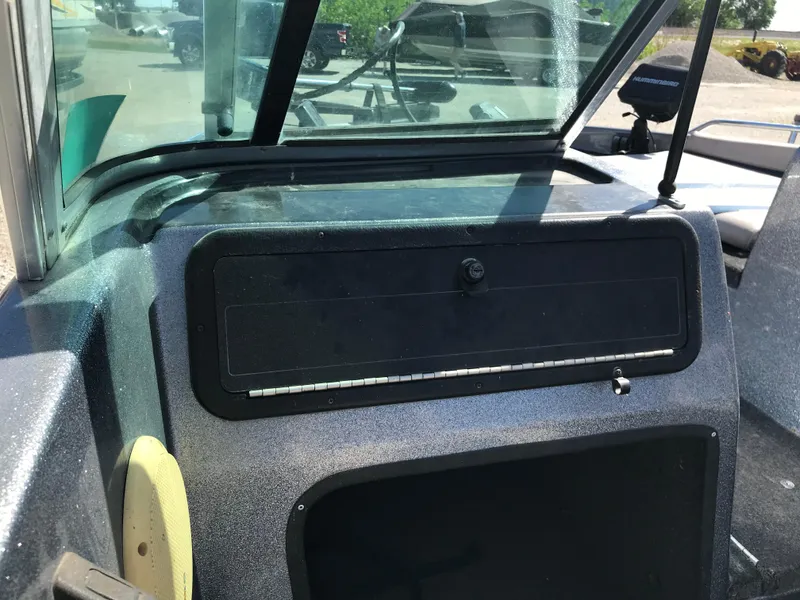 Slide: The Image of 1994 ProCraft COMBO 200 boat dashboard with windshield and storage compartment. - 20