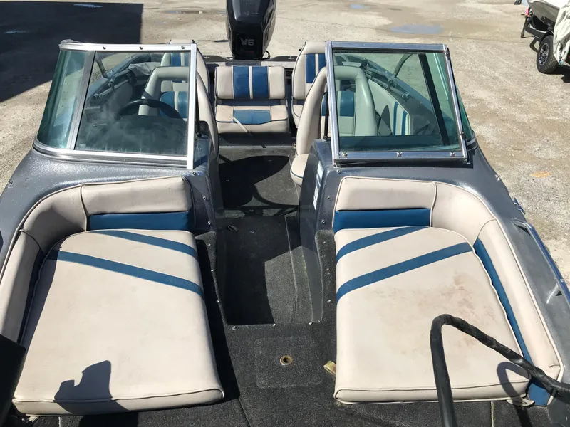 Slide: The Image of 1994 ProCraft COMBO 200 boat interior with blue and white seating, open windshield. - 22