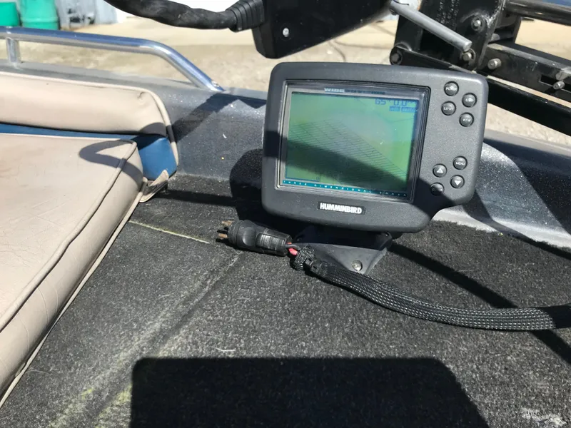 Slide: The Image of Fishfinder on a 1994 ProCraft COMBO 200 boat dashboard. - 26
