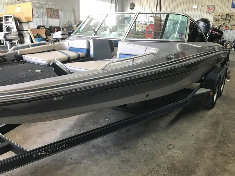 Slide: The Image of 1994 ProCraft COMBO 200 boat in a garage, on a trailer. - 3