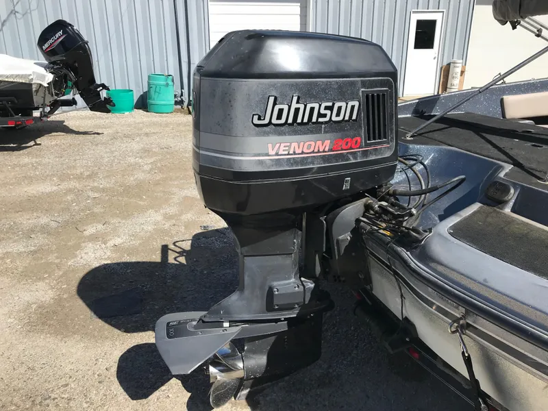 Slide: The Image of 1994 ProCraft COMBO 200 with Johnson Venom 200 outboard motor in a sunny outdoor setting. - 37