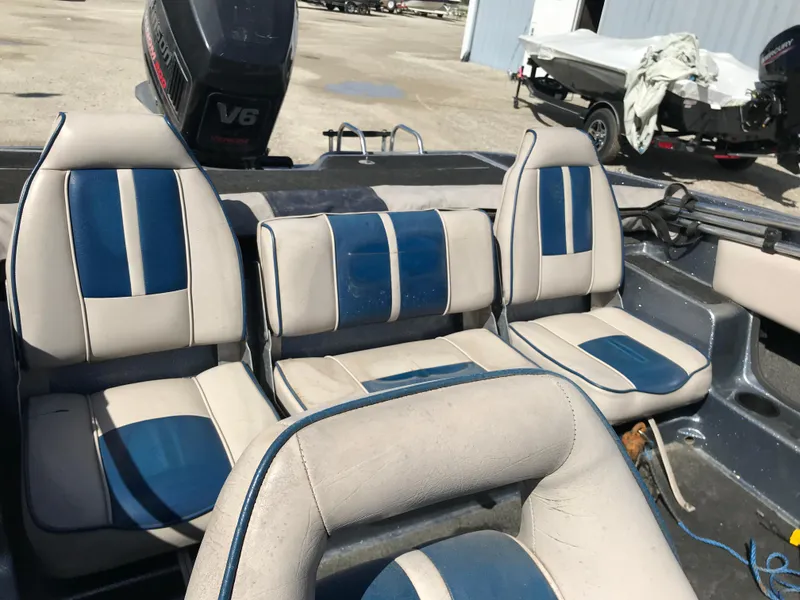 Slide: The Image of 1994 ProCraft COMBO 200 boat interior with blue and white seating, V6 engine visible. - 4