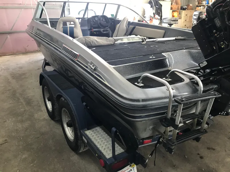 Slide: The Image of 1994 ProCraft COMBO 200 boat on trailer in garage setting. - 5
