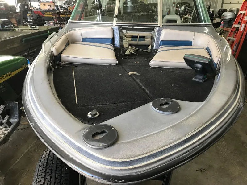 Slide: The Image of 1994 ProCraft COMBO 200 boat interior with seating and carpeted deck. - 6