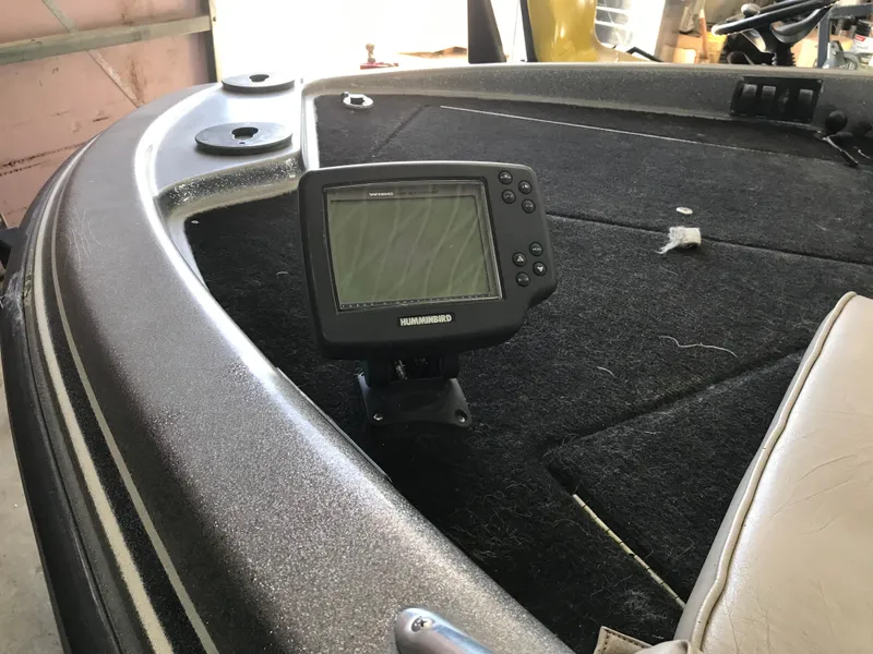 Slide: The Image of 1994 ProCraft COMBO 200 boat interior with Humminbird fish finder on deck. - 8