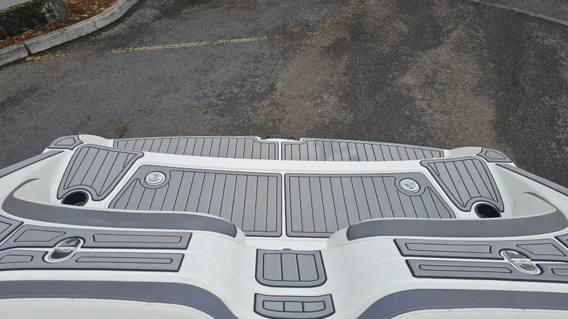 Slide: The Image of 2014 Yamaha AR210 boat deck with gray and white design. - 22