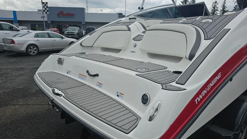 Slide: The Image of 2014 Yamaha AR210 boat with twin engines, rear view in a parking lot. - 6