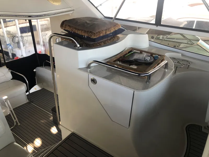 Slide: The Image of 2006 Carver 43 Motor Yacht interior with seating and helm station. - 14