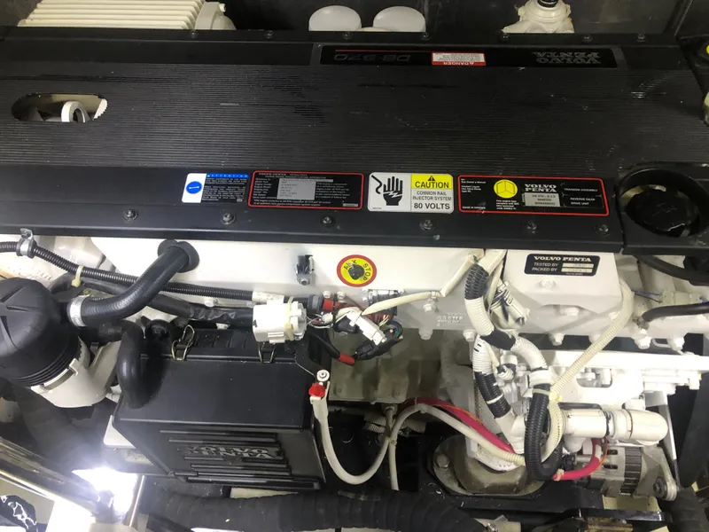 Slide: The Image of Engine compartment of a 2006 Carver 43 Motor Yacht, featuring detailed components and labels. - 30