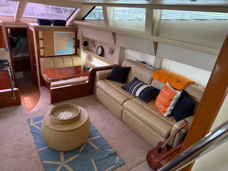 Slide: The Image of Interior of 2006 Carver 43 Motor Yacht with cozy seating and nautical decor. - 37