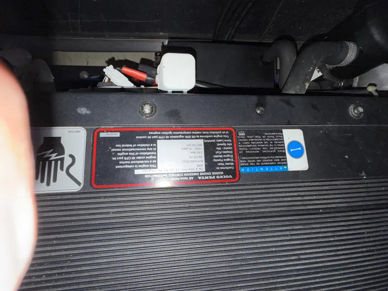 Slide: The Image of Close-up of a 2006 Carver 43 Motor Yacht engine component with labels and connectors. - 42