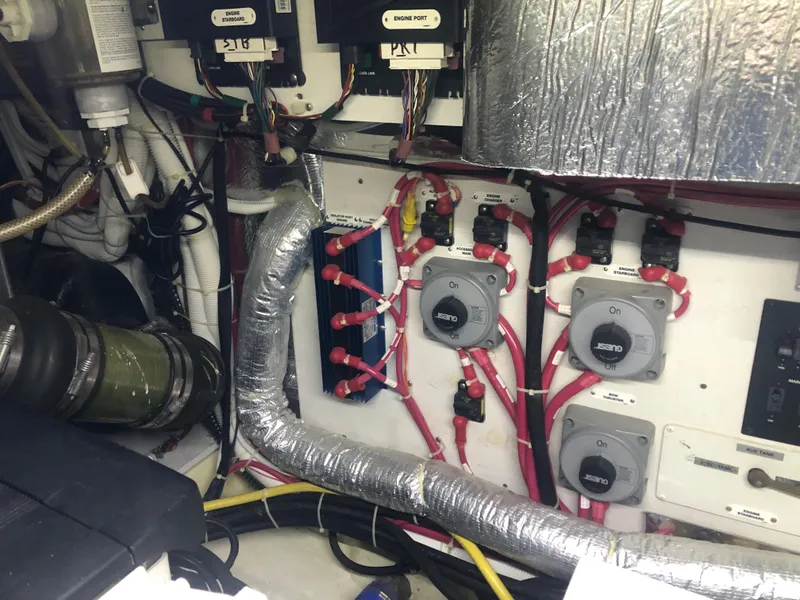 Slide: The Image of Engine room of a 2006 Carver 43 Motor Yacht with wiring and control panels. - 26