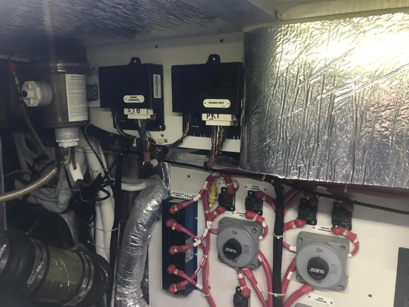 Slide: The Image of Engine room of a 2006 Carver 43 Motor Yacht with wiring and components. - 27