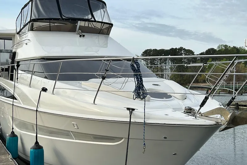 Slide: The Image of 2006 Carver 43 Motor Yacht docked at marina, featuring sleek design and modern amenities. - 3