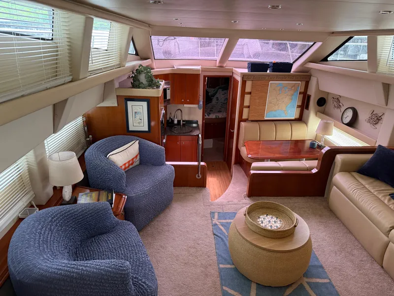 Slide: The Image of Luxurious interior of 2006 Carver 43 Motor Yacht with cozy seating and elegant decor. - 38