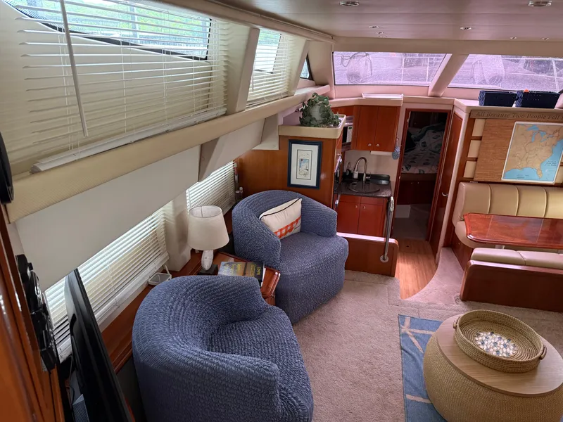 Slide: The Image of Interior of 2006 Carver 43 Motor Yacht with cozy seating and elegant decor. - 39