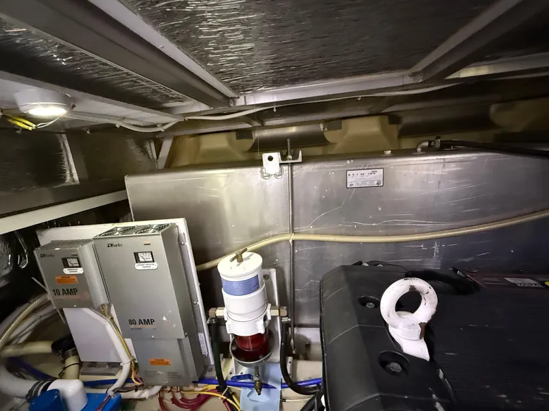 Slide: The Image of Engine room of 2006 Carver 43 Motor Yacht with electrical components and fuel filter. - 41