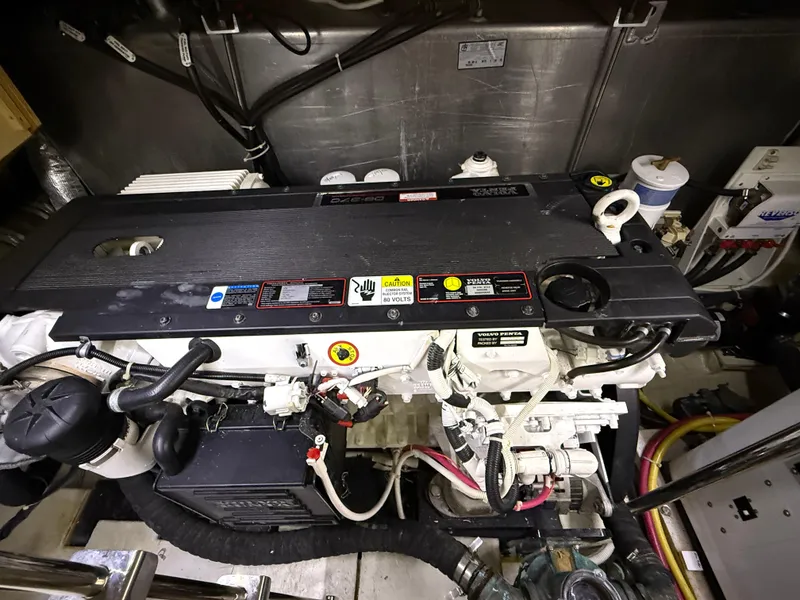 Slide: The Image of Engine room of a 2006 Carver 43 Motor Yacht, showcasing detailed mechanical components. - 45