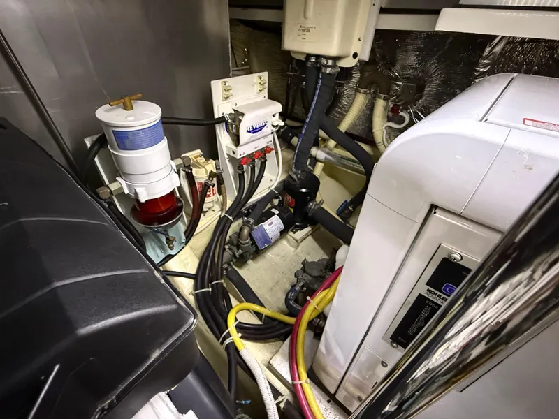 Slide: The Image of Engine room of 2006 Carver 43 Motor Yacht with various mechanical components. - 46