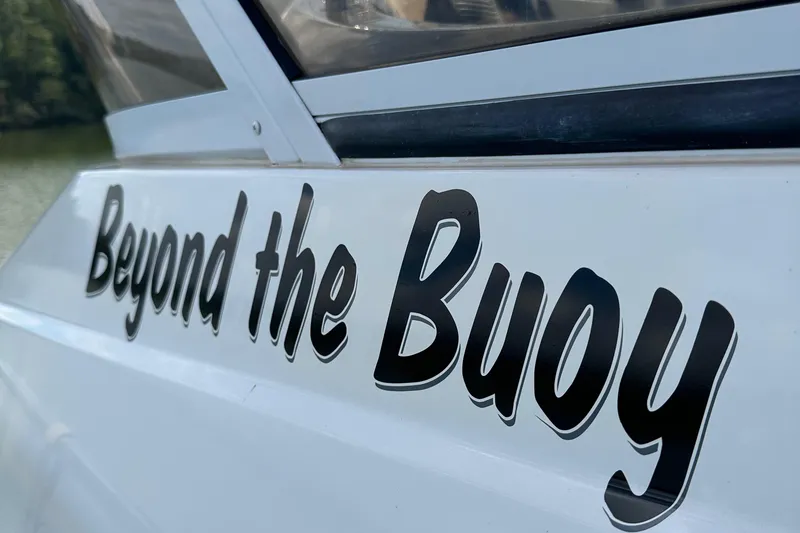 Slide: The Image of 2006 Carver 43 Motor Yacht with "Beyond the Buoy" lettering on the side. - 7