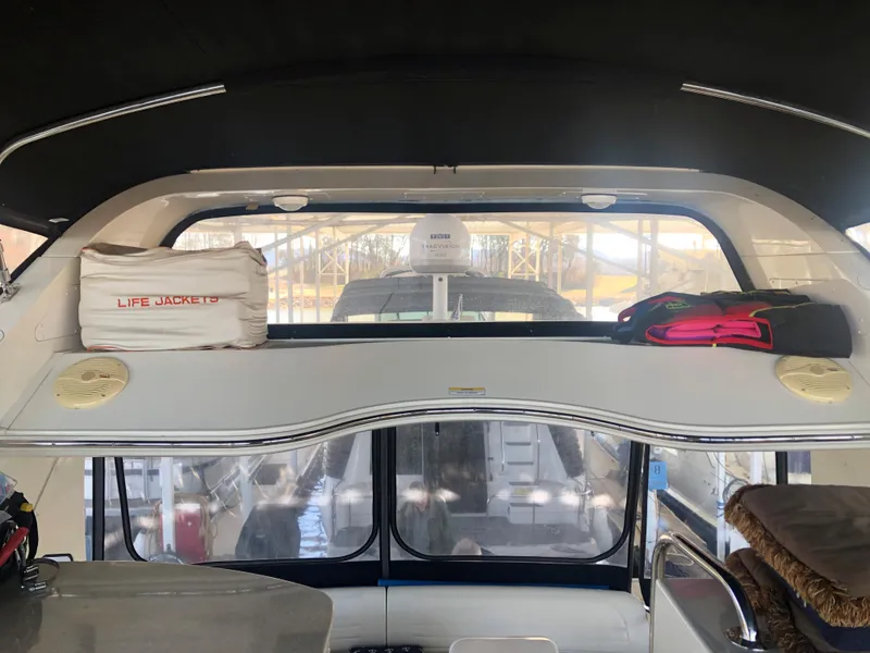 Slide: The Image of 2006 Carver 43 Motor Yacht interior with life jackets and storage shelf. - 8