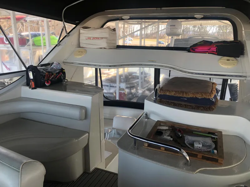 Slide: The Image of 2006 Carver 43 Motor Yacht interior with seating, storage, and helm area. - 9