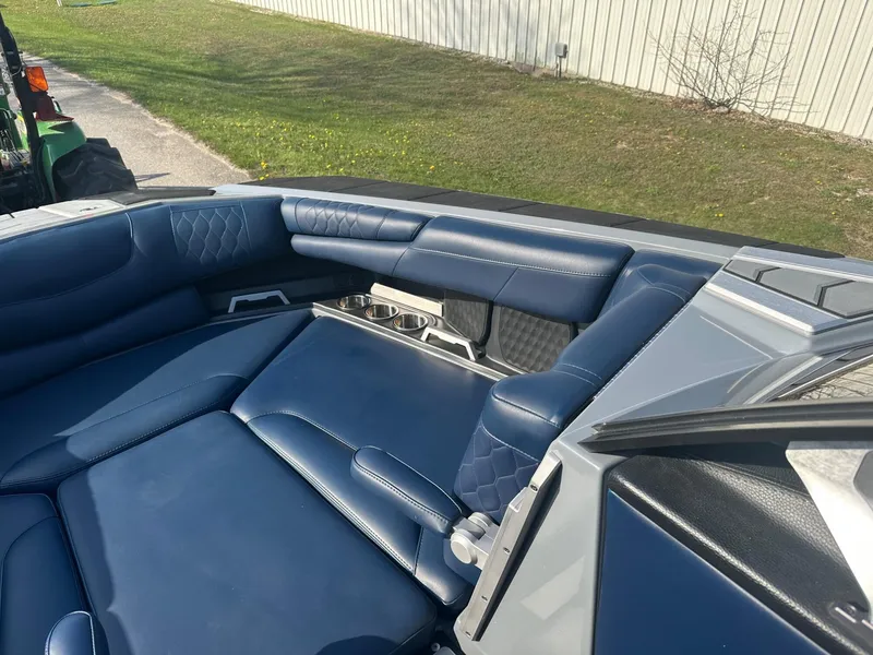 Slide: The Image of 2020 Malibu M240 boat interior with blue leather seating and modern design. - 17