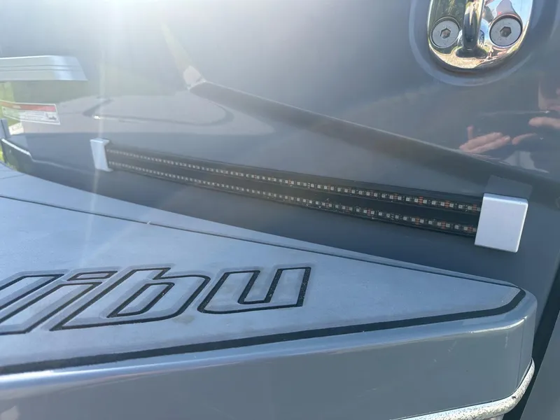 Slide: The Image of 2020 Malibu M240 boat with LED lighting and logo detail. - 20