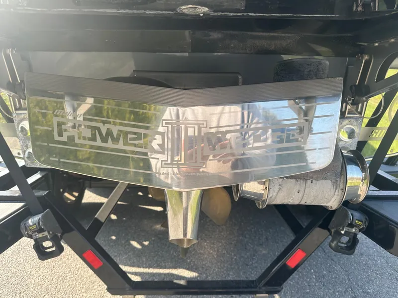 Slide: The Image of 2020 Malibu M240 boat with Power Wedge III feature, rear view. - 22