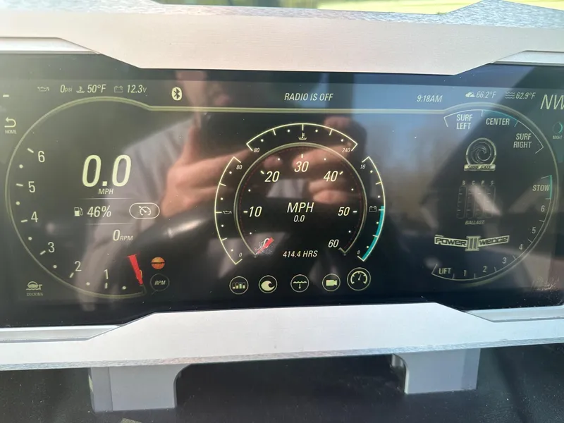 Slide: The Image of Dashboard of a 2020 Malibu M240 boat showing speedometer and various controls. - 26