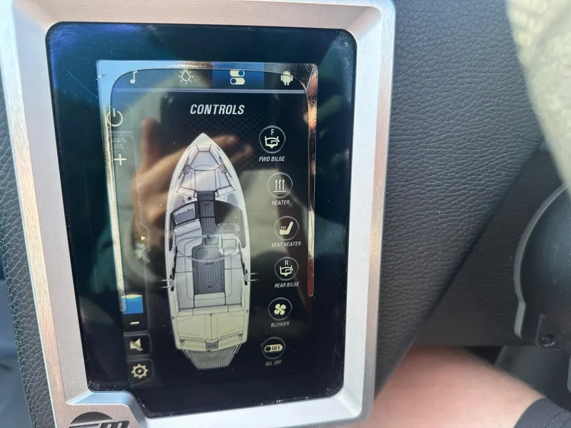 Slide: The Image of Touchscreen control panel of a 2020 Malibu M240 boat displaying various settings. - 27