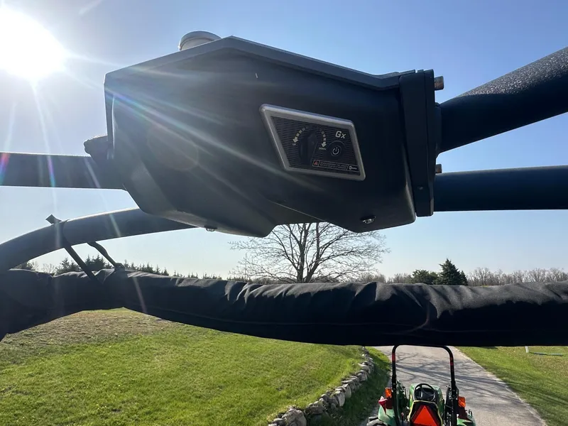 Slide: The Image of 2020 Malibu M240 boat tower with speaker, sunny outdoor setting. - 33