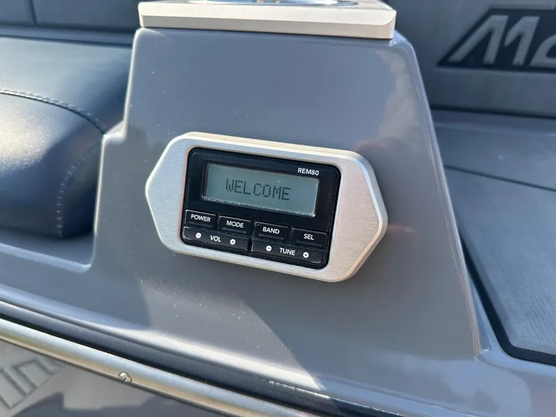 Slide: The Image of Control panel of a 2020 Malibu M240 boat displaying "Welcome" message. - 35