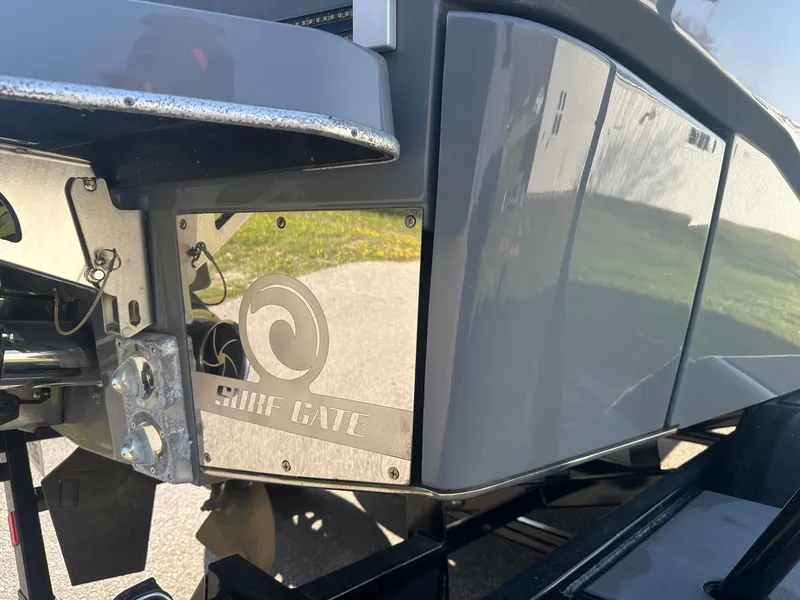 Slide: The Image of 2020 Malibu M240 boat with Surf Gate technology, close-up view. - 36