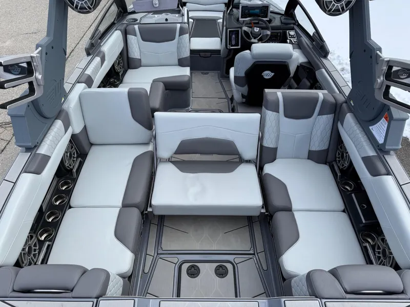 Slide: The Image of 2021 Malibu M240 boat interior with luxurious seating and modern design. - 11