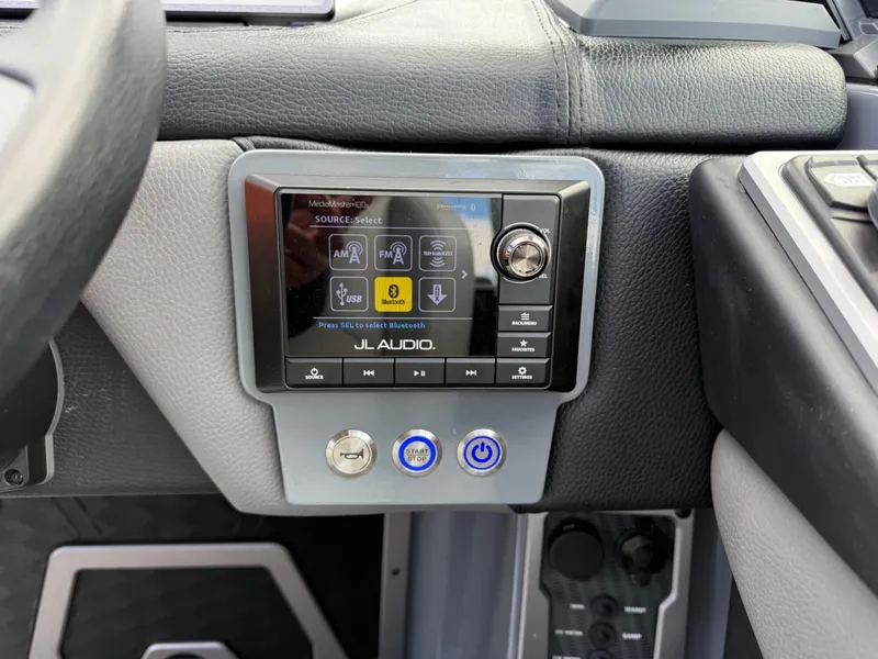 Slide: The Image of 2021 Malibu M240 dashboard with JL Audio system and control panel. - 20