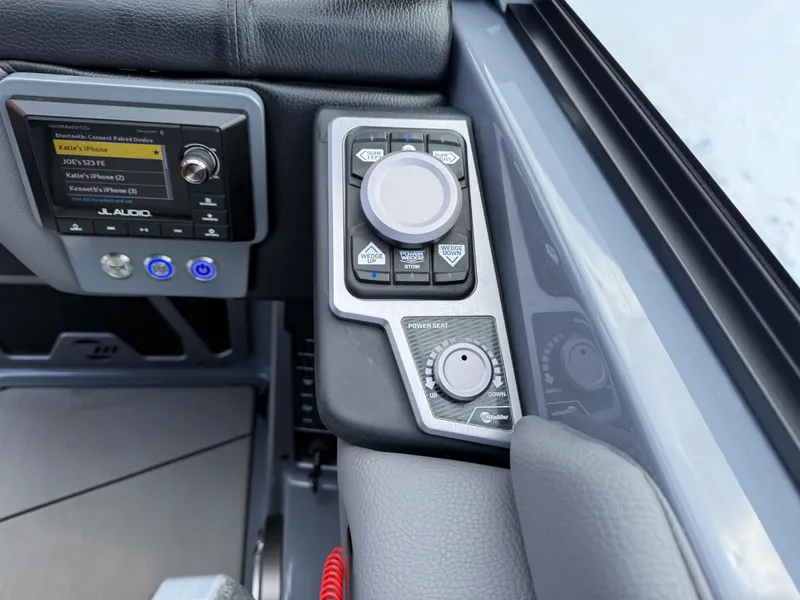 Slide: The Image of 2021 Malibu M240 boat dashboard with JL Audio controls and advanced navigation system. - 21