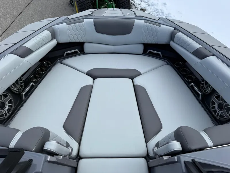 Slide: The Image of 2021 Malibu M240 boat interior with luxurious gray seating and modern design. - 23