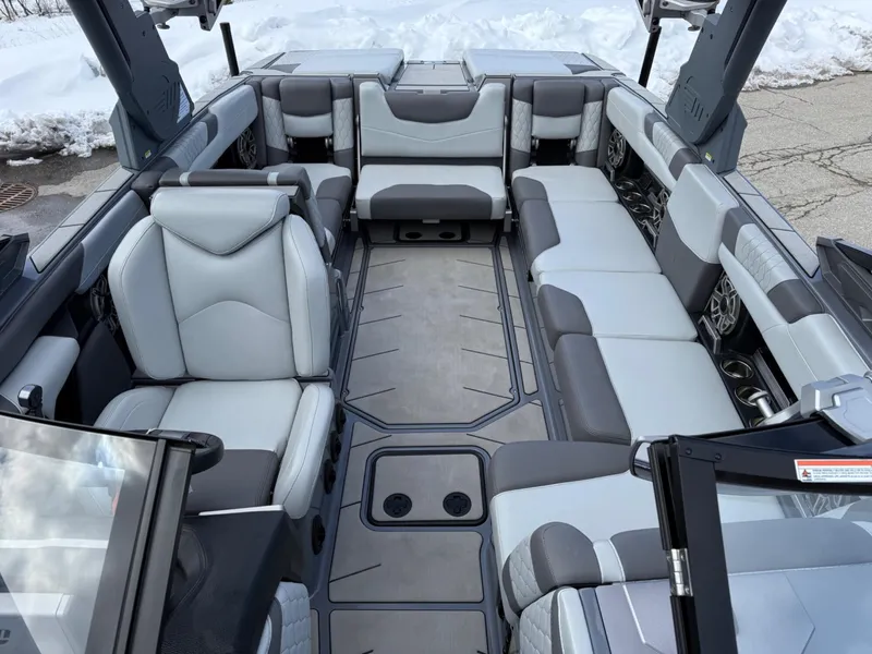 Slide: The Image of 2021 Malibu M240 boat interior with luxurious gray seating and modern design. - 25