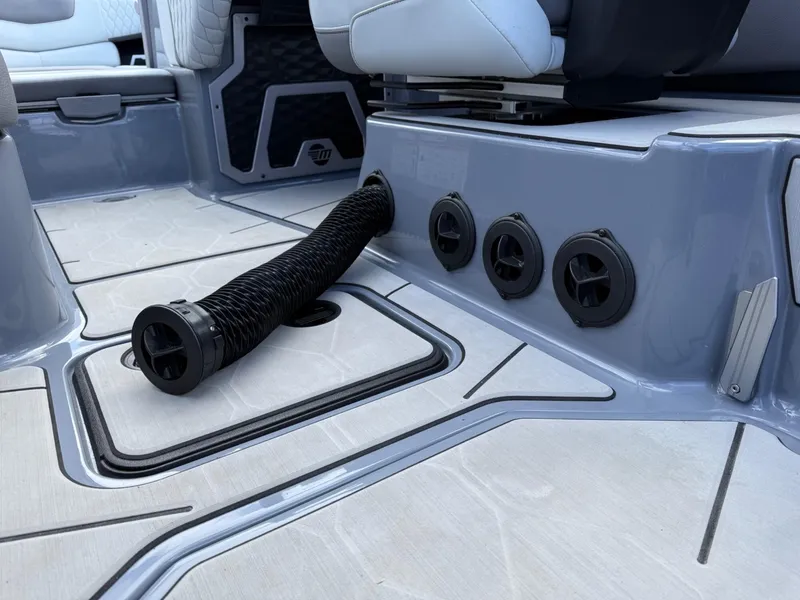 Slide: The Image of Interior of 2021 Malibu M240 boat with ventilation system and seating. - 27