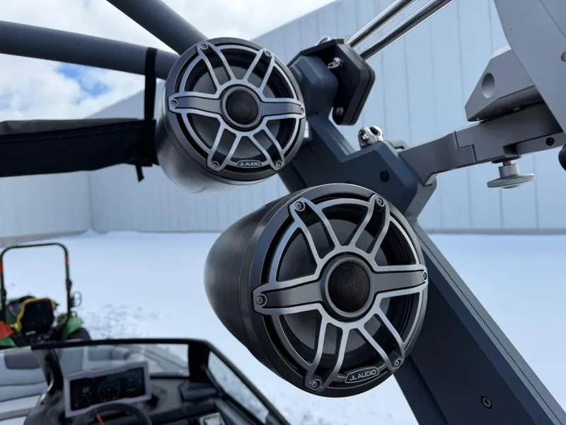 Slide: The Image of 2021 Malibu M240 boat speakers mounted on a wakeboard tower in a snowy setting. - 28