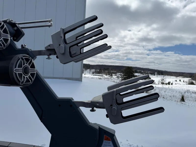 Slide: The Image of 2021 Malibu M240 boat tower with wakeboard racks against snowy landscape. - 29